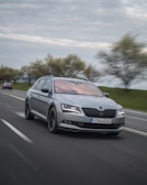 A dynamic shot of a car speeding down a winding road.
