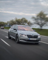 A dynamic shot of a car speeding on a highway with a blurred background.