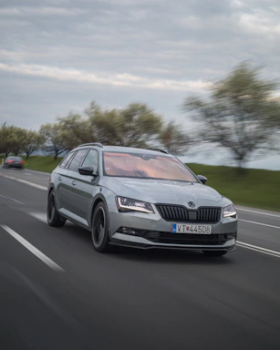 A dynamic shot of a car in motion on a highway.