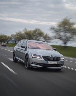 A dynamic shot of a car speeding down a winding road.