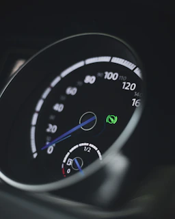 Close-up of a hybrid vehicle dashboard highlighting eco-friendly features