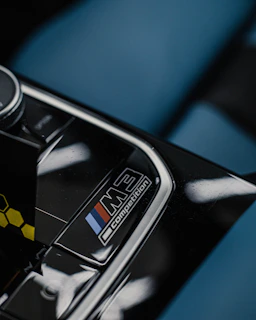 BMW dashboard featuring a subtle yet striking M Performance badge on the interior trim.