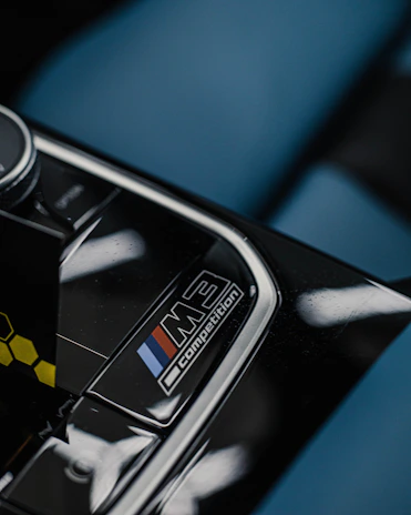 BMW dashboard featuring a subtle yet striking M Performance badge on the interior trim.