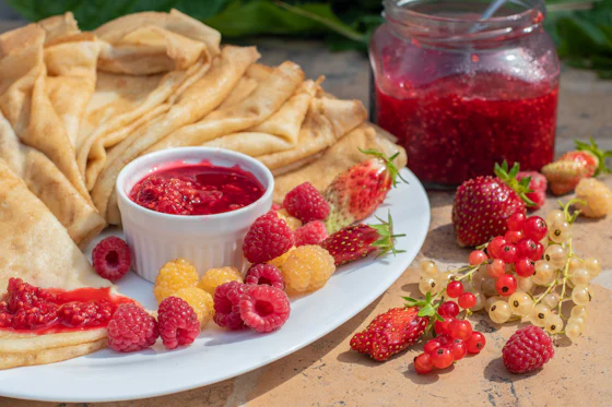 Raspberry jelly dessert with fresh berries