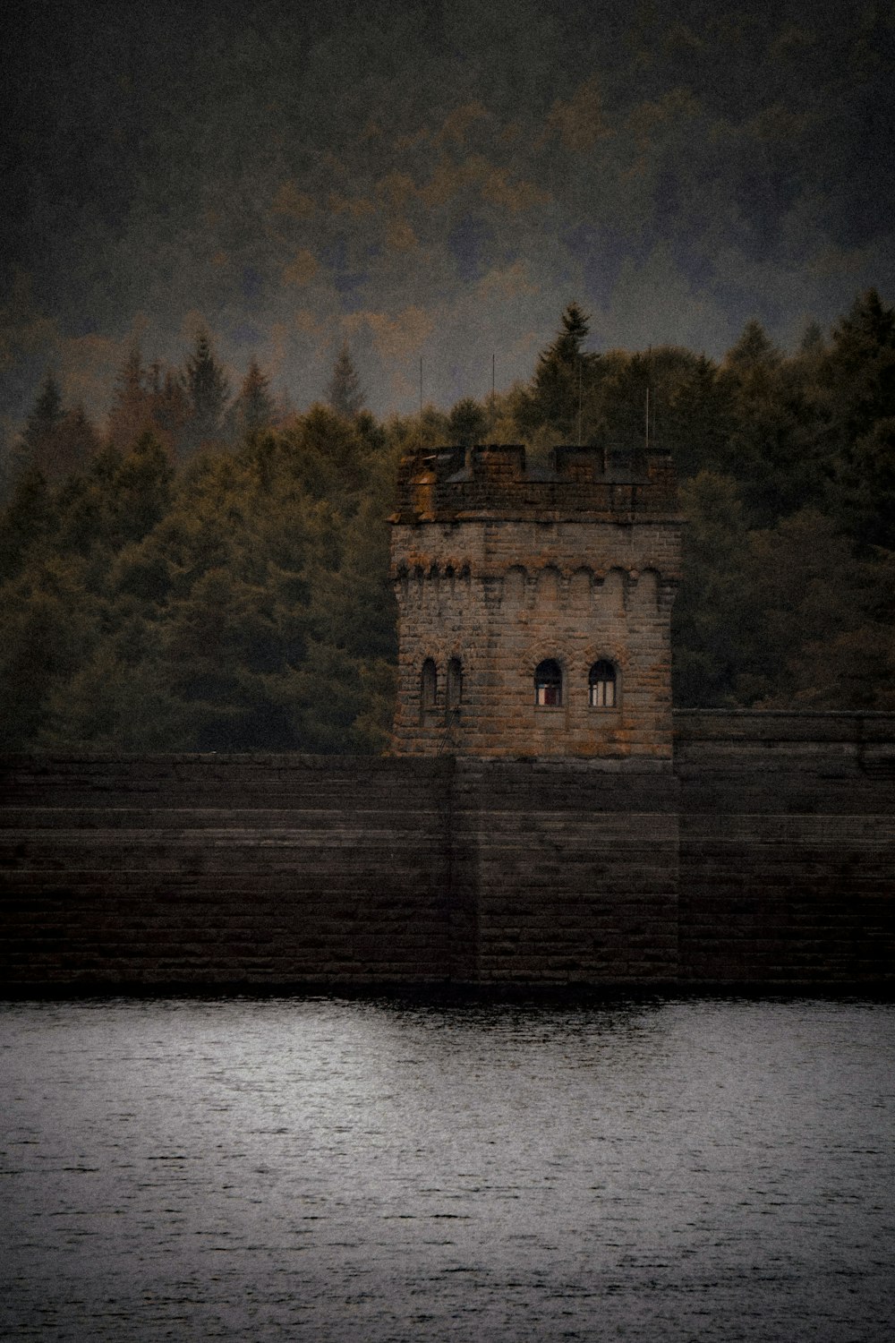 a large building sitting next to a body of water