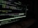 A computer screen displaying code in a dark-themed text editor. The code appears to be written in JavaScript, featuring functions and navigation links. There are file paths and command line interface windows open. A dark environment enhances the glow of the screen.