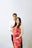 a pregnant couple posing for a picture