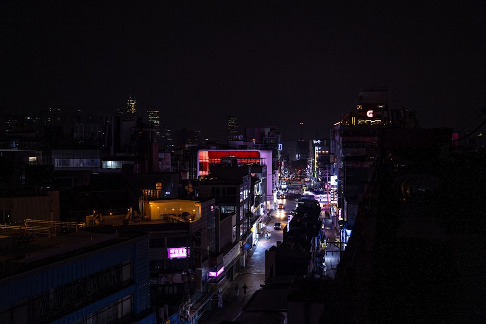 a city street filled with lots of traffic at night