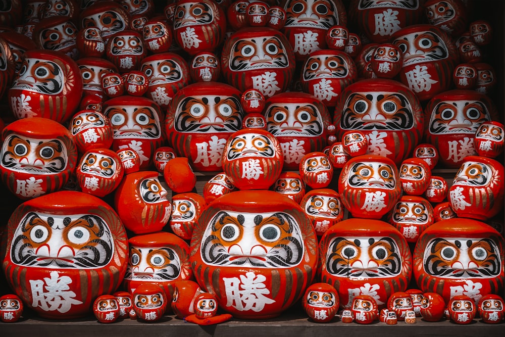 a large group of red and white masks