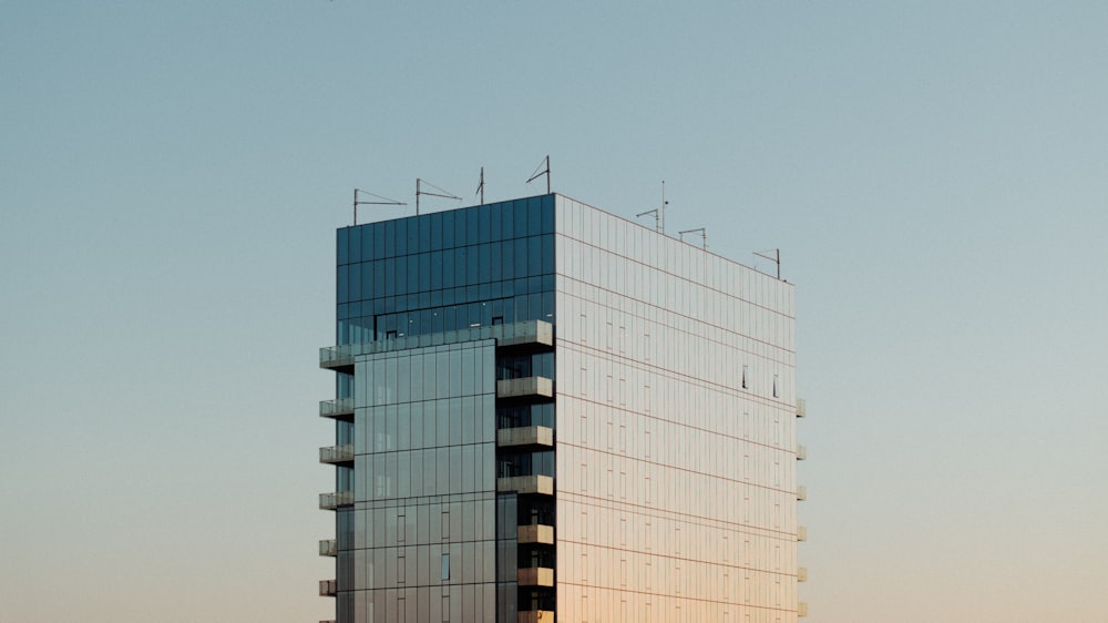 a tall building with a sky background