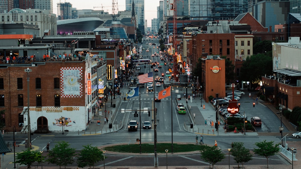 a city street filled with lots of traffic and tall buildings