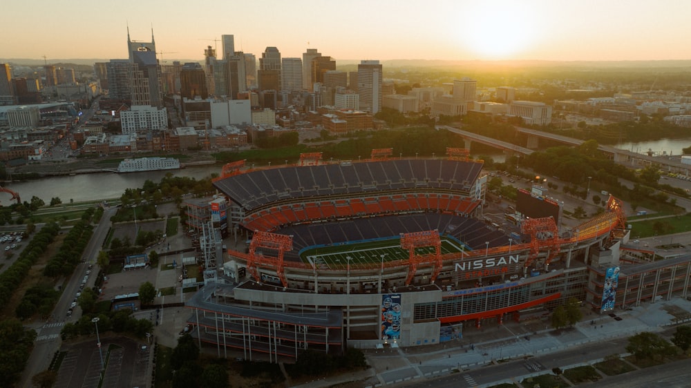 an aerial view of a football stadium at sunset