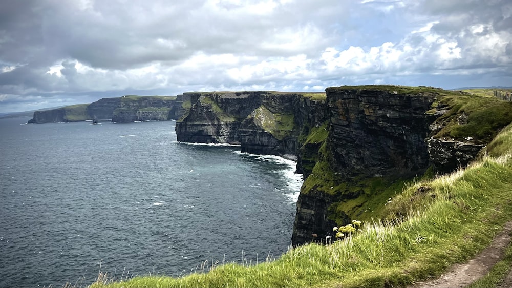 a large body of water near a cliff