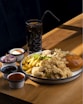 a plate of food on a wooden table