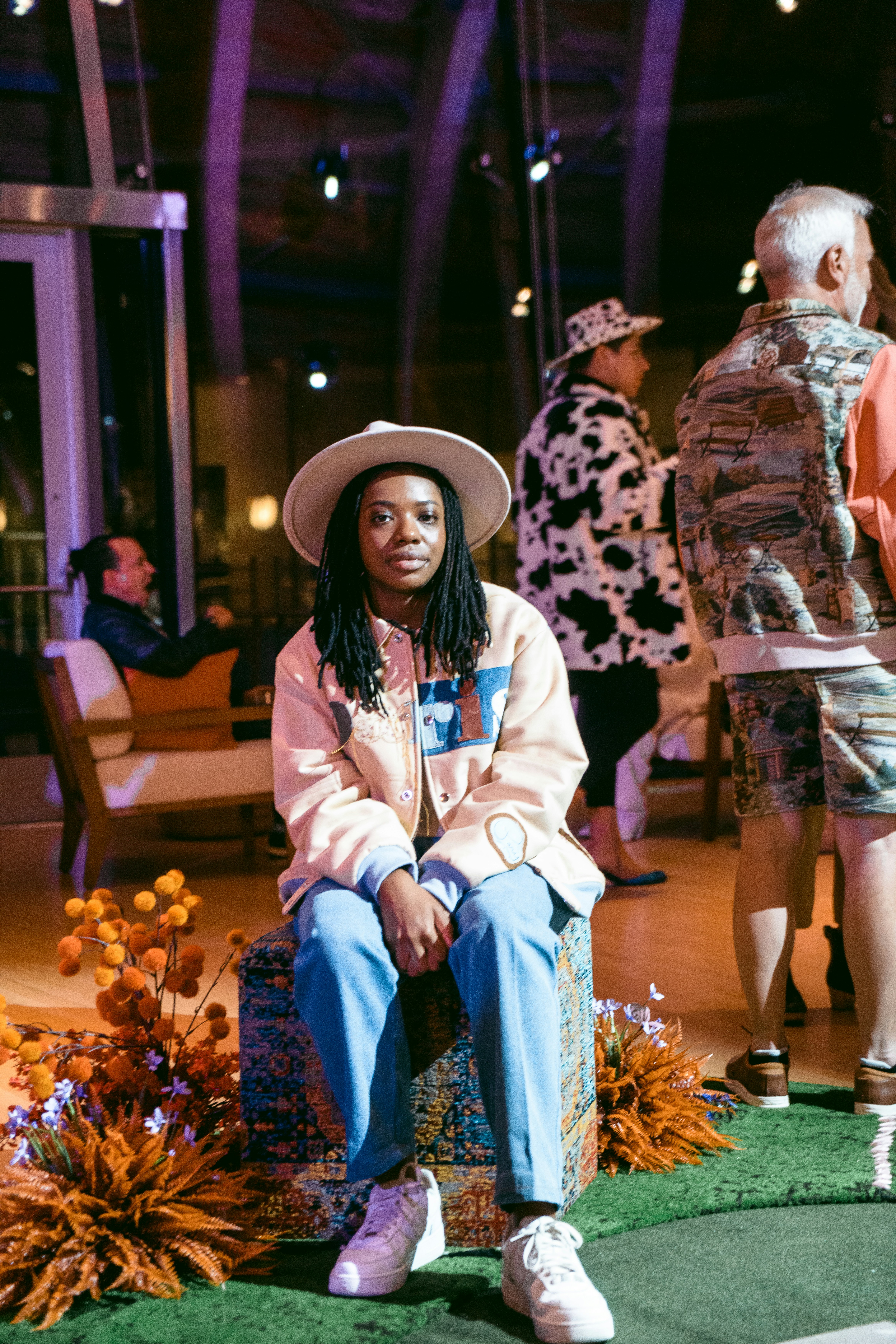 a person sitting on a chair in a room