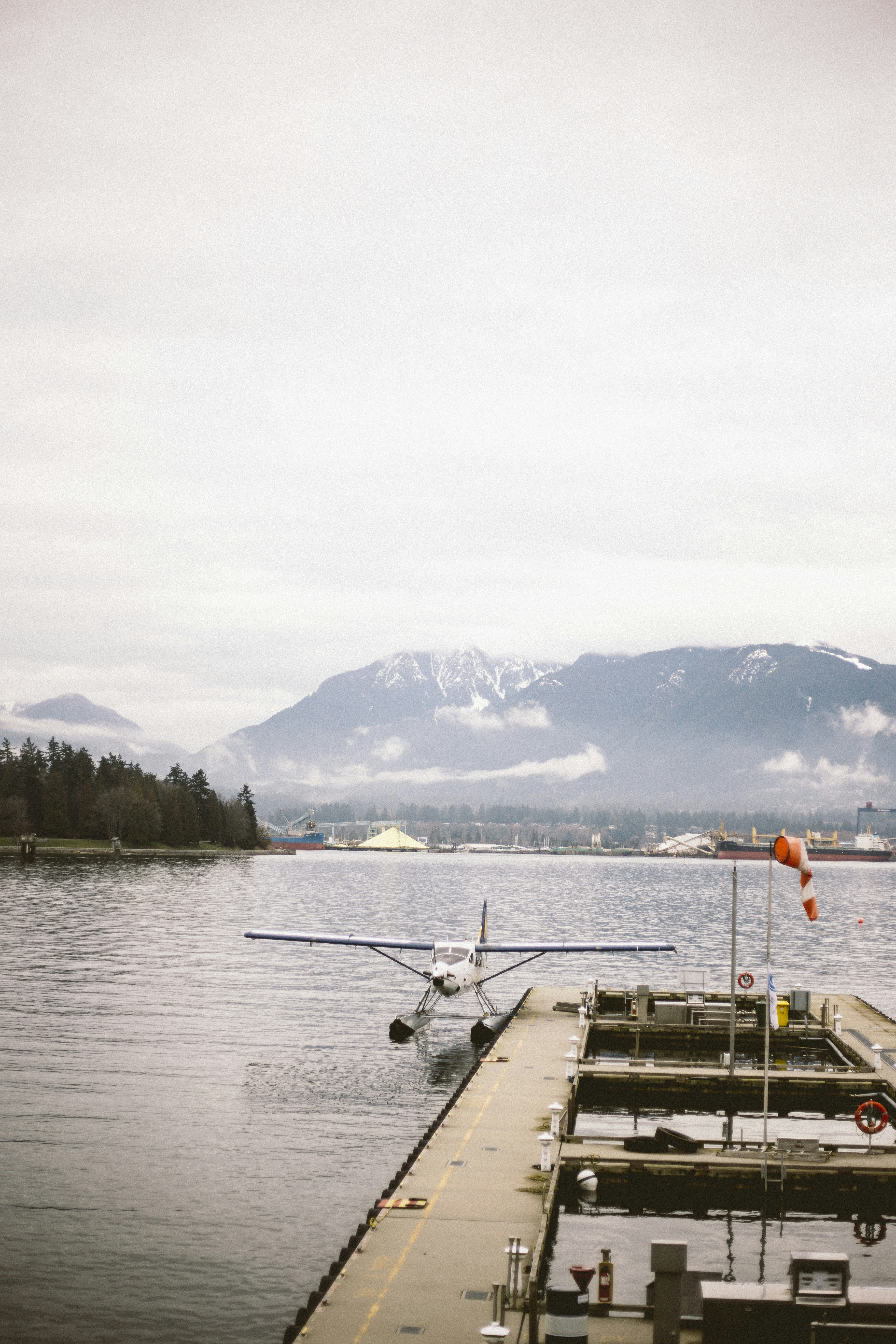 a small plane is parked at a dock