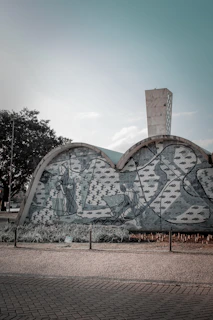 A timeline mural blending traditional Moorish architecture with sleek, futuristic cityscapes.