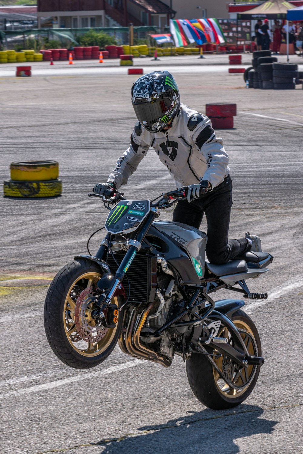 a man riding a motorcycle on top of a race track