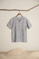 a t - shirt hanging on a clothes line