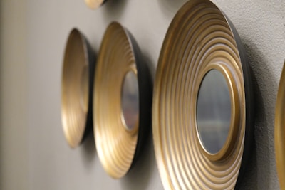 Wall display featuring various metal prints with different finishes.