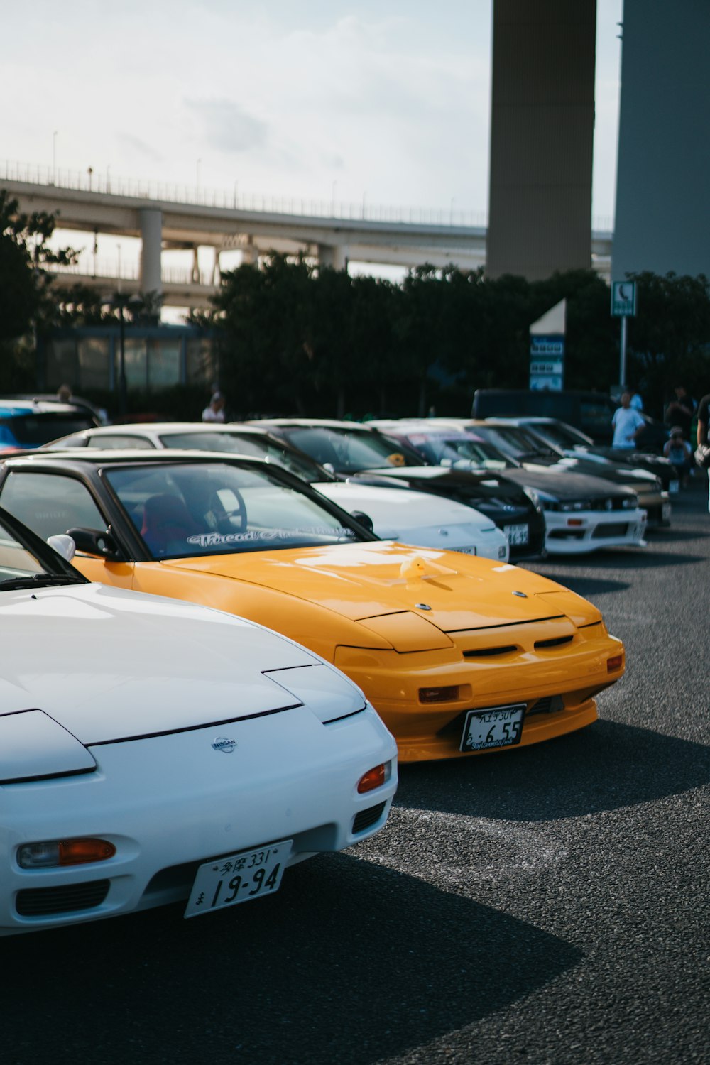 a row of parked cars in a parking lot