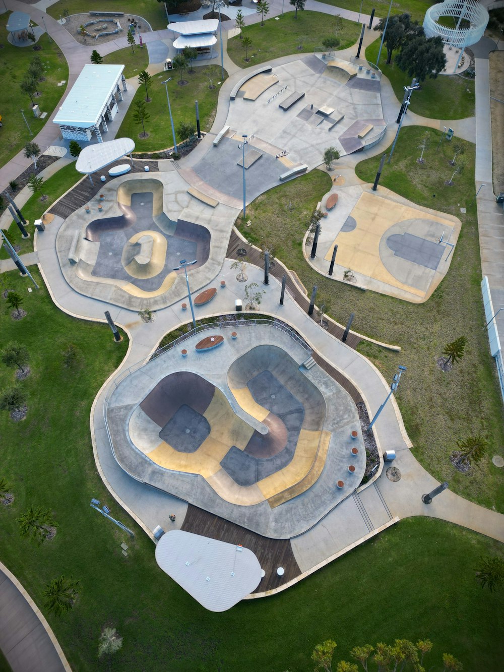 an aerial view of a skate park with ramps and ramps