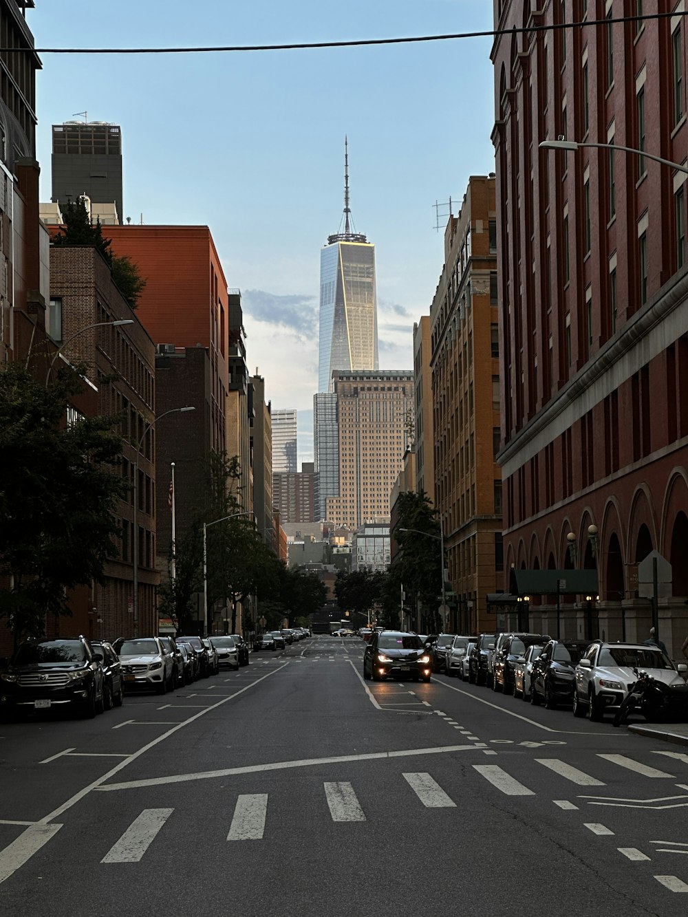 a city street with cars parked on both sides