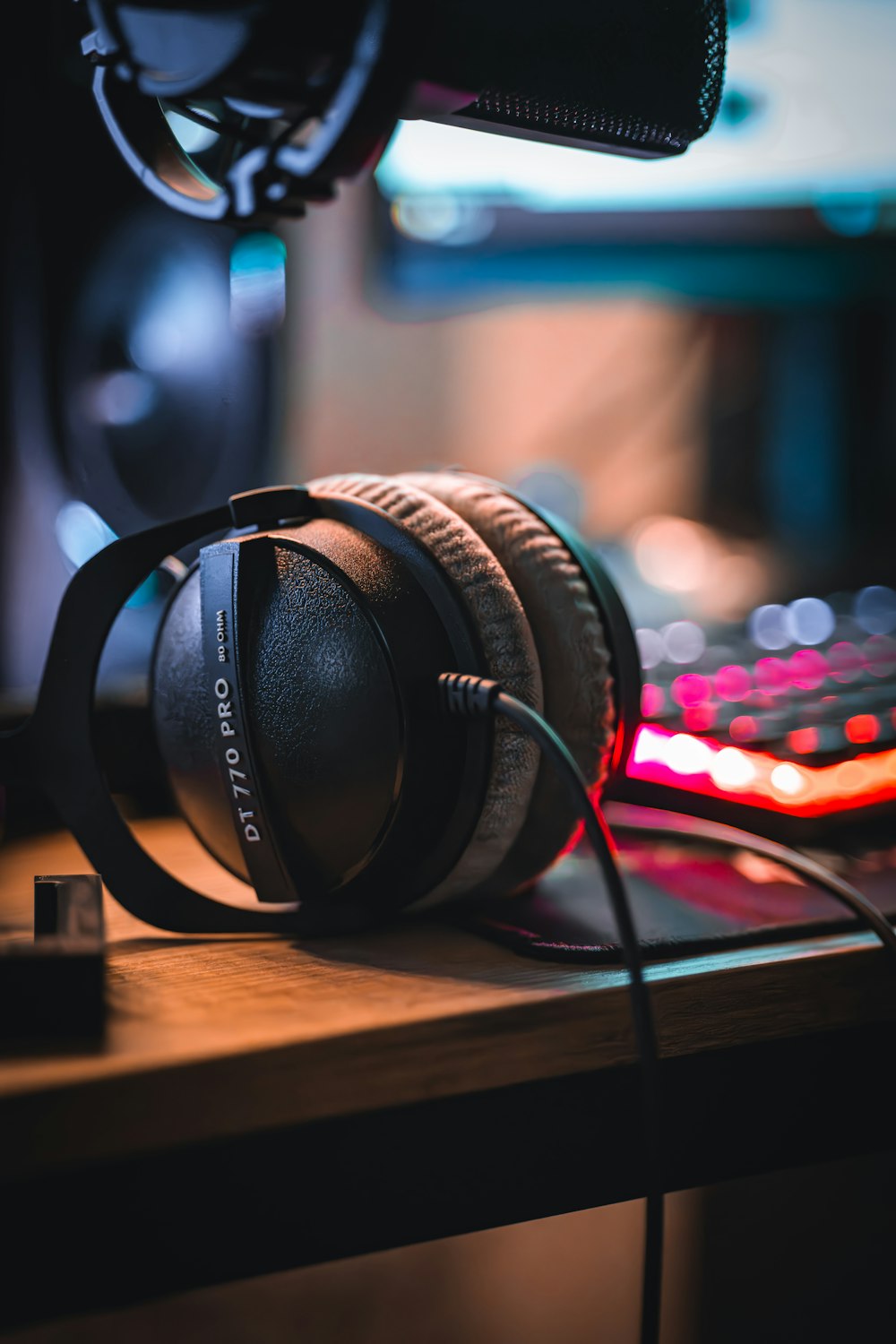 a pair of headphones sitting on top of a desk