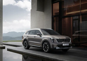 a silver car parked in front of a building