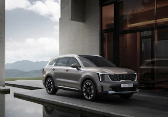 a silver car parked in front of a building