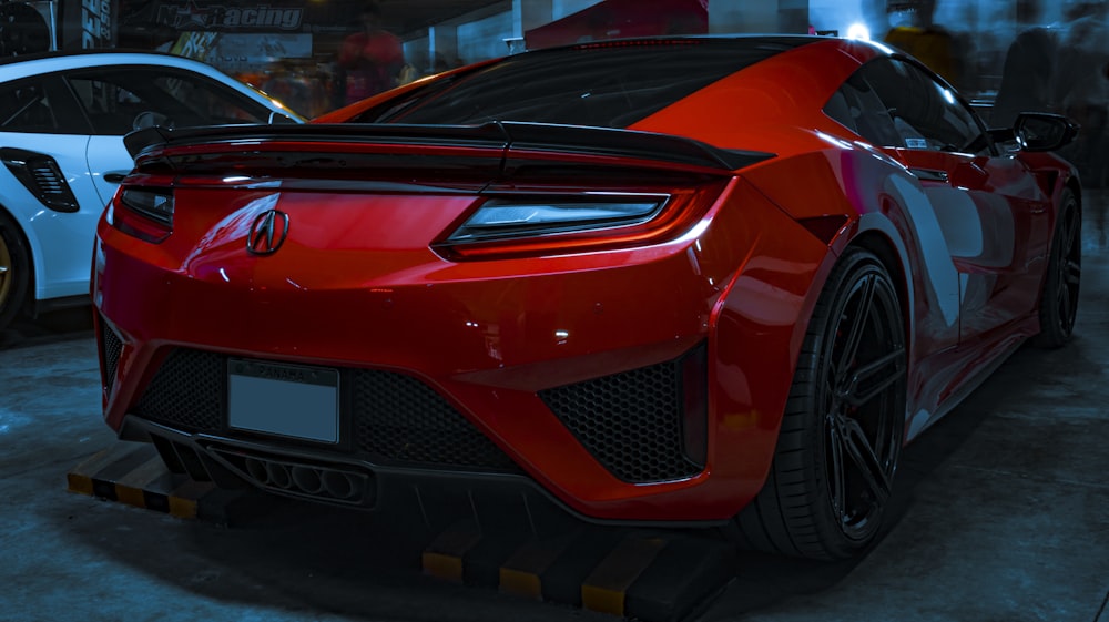 a red sports car parked in a garage