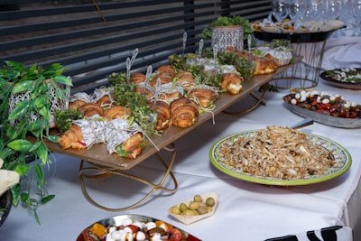 a buffet table filled with lots of food
