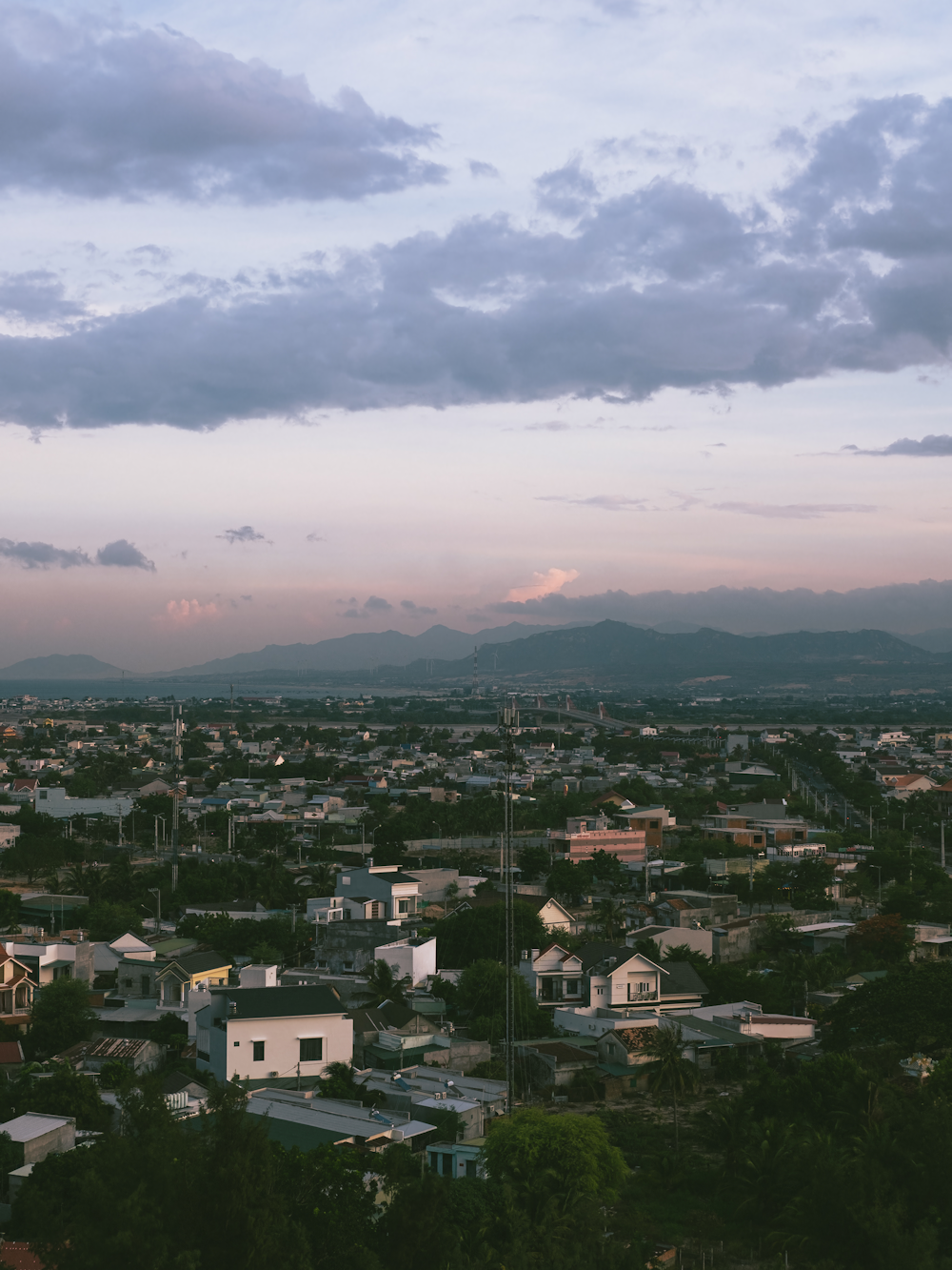 a view of a city with mountains in the background