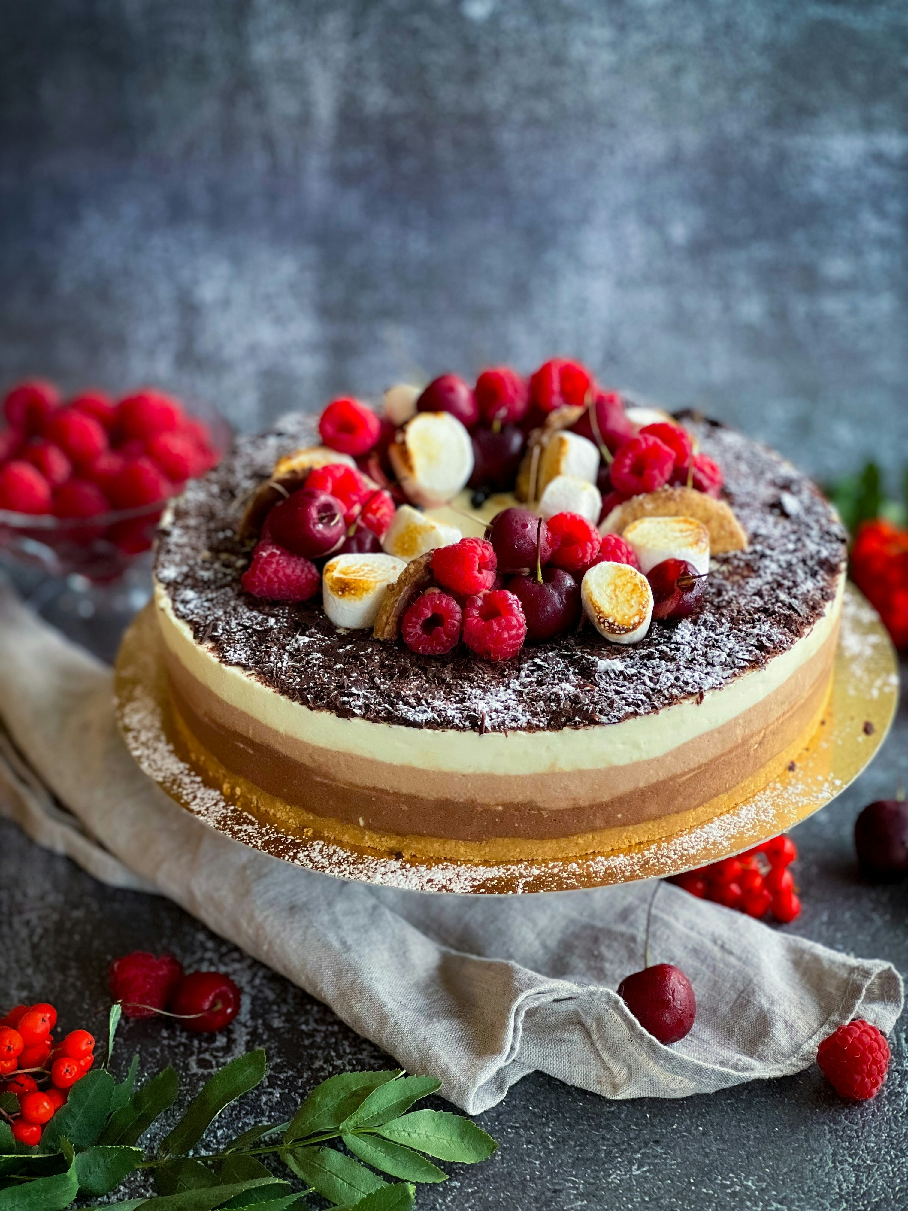 a cake with raspberries on top of it