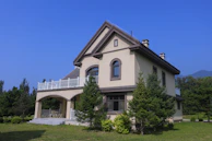 a large house with a balcony and a balcony
