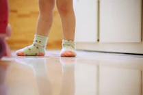 a close up of a child's feet wearing socks