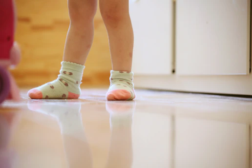 a close up of a child's feet wearing socks