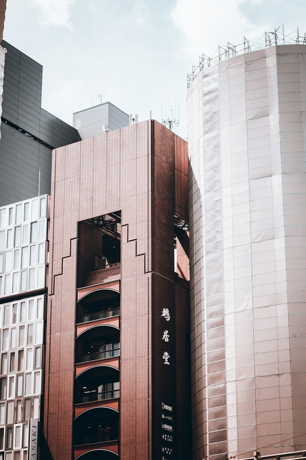 a tall building with a lot of windows in front of it