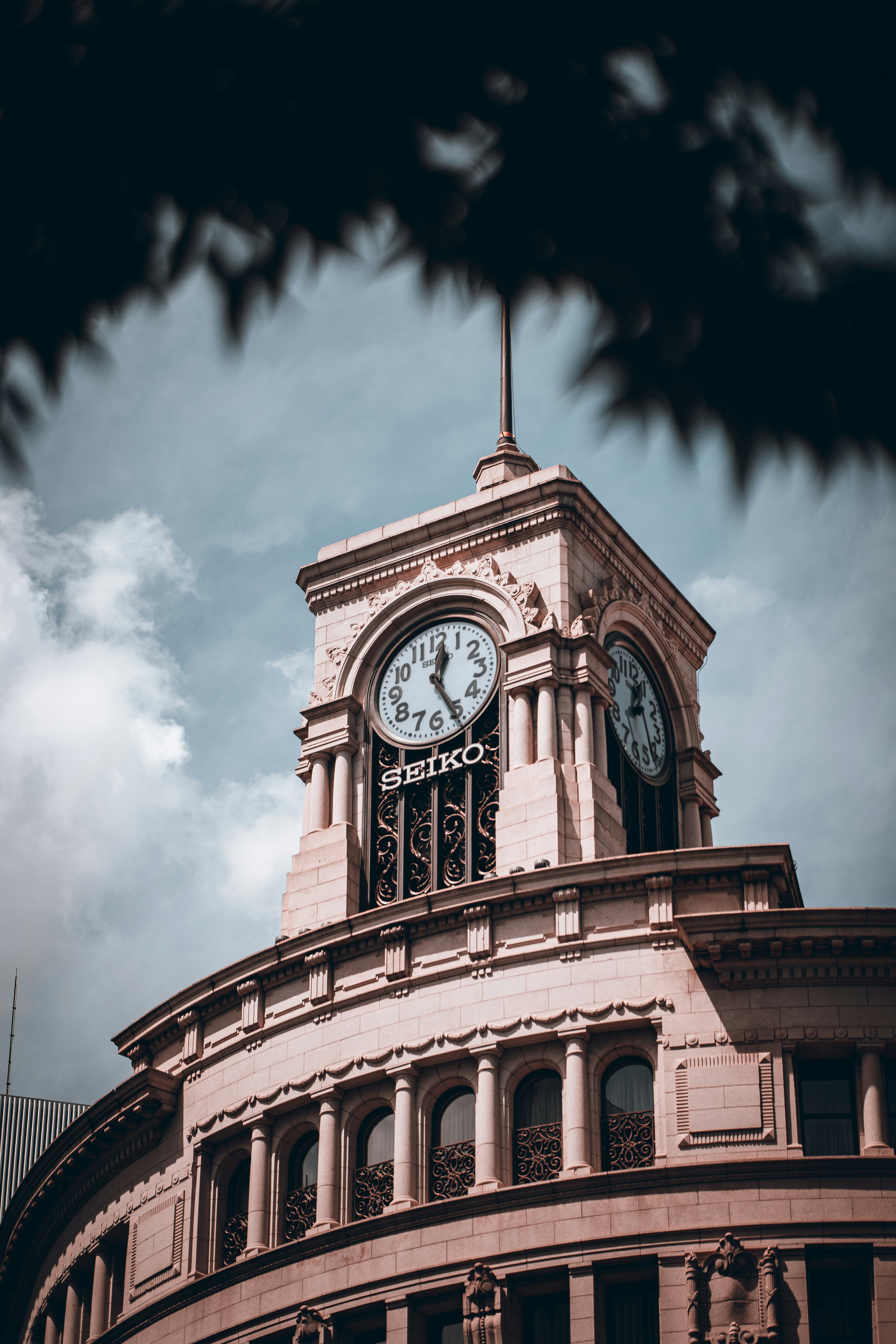 A clock tower on top of a building photo – Free Art Image on Unsplash