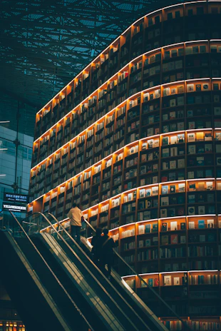 An elegant display of Elevate Academy’s book collection arranged on a modern shelf with soft natural lighting.