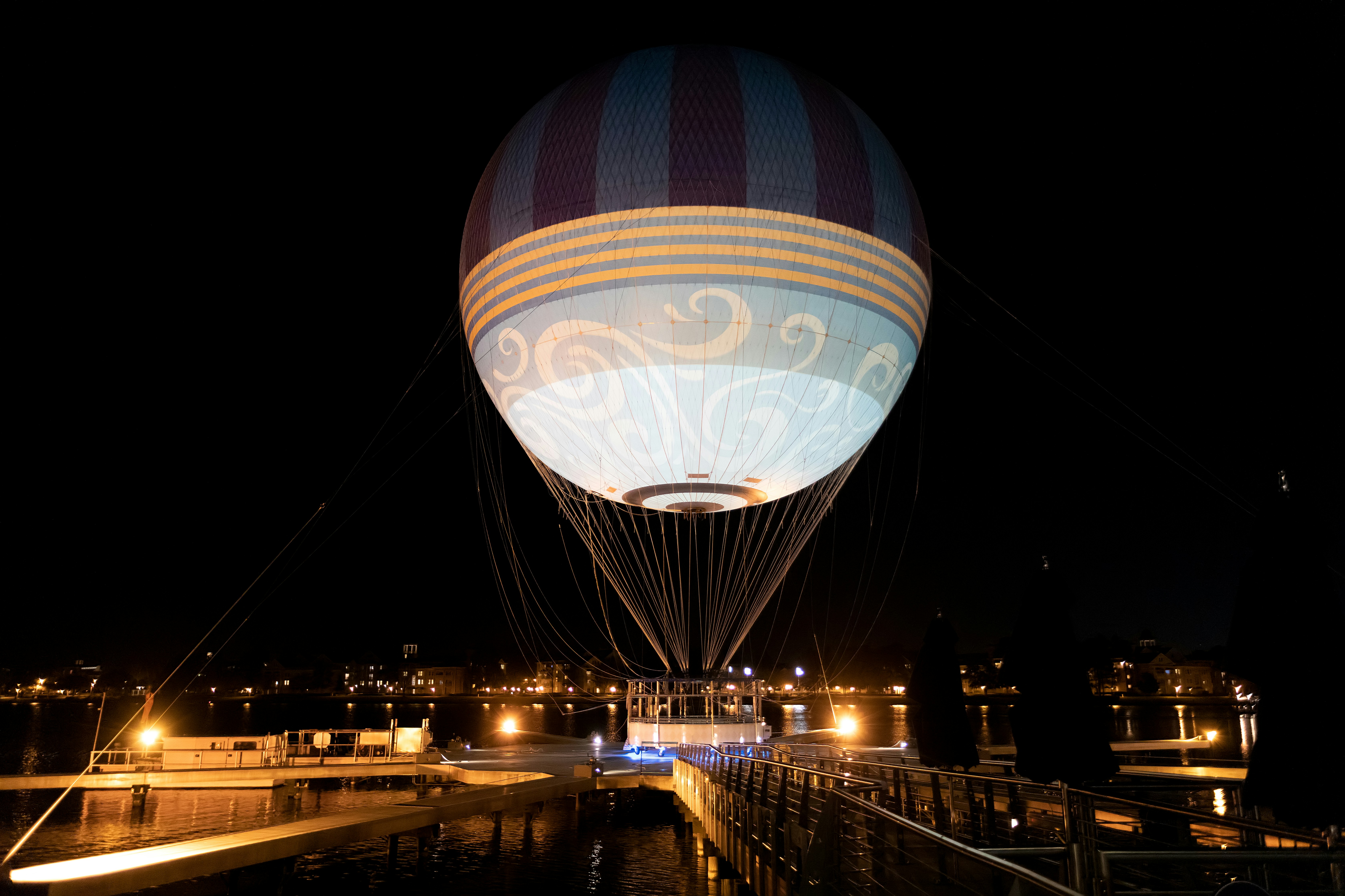 a hot air balloon is lit up at night