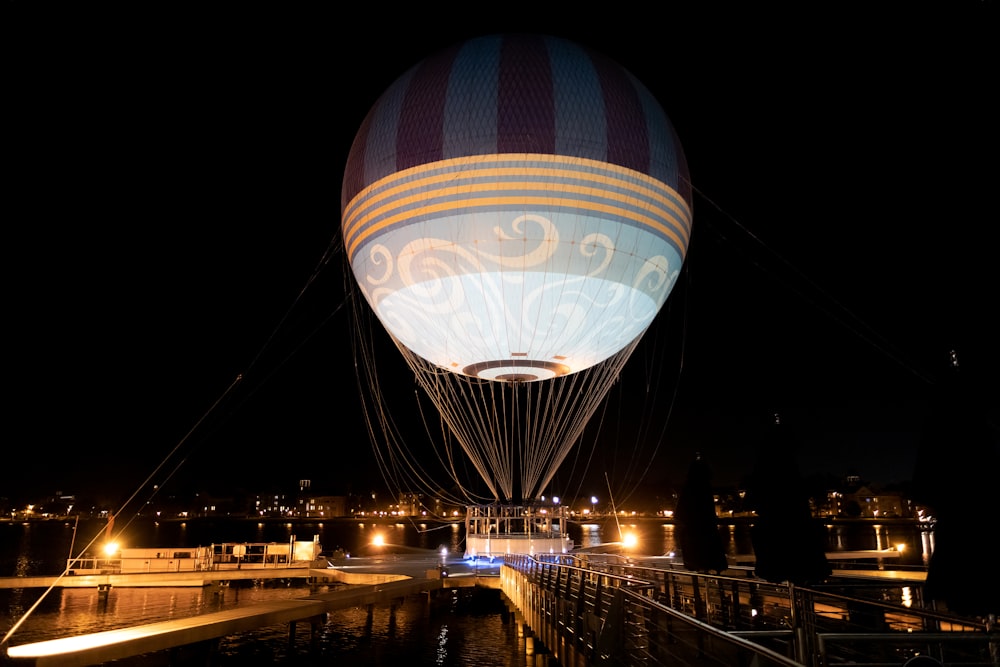 a hot air balloon is lit up at night