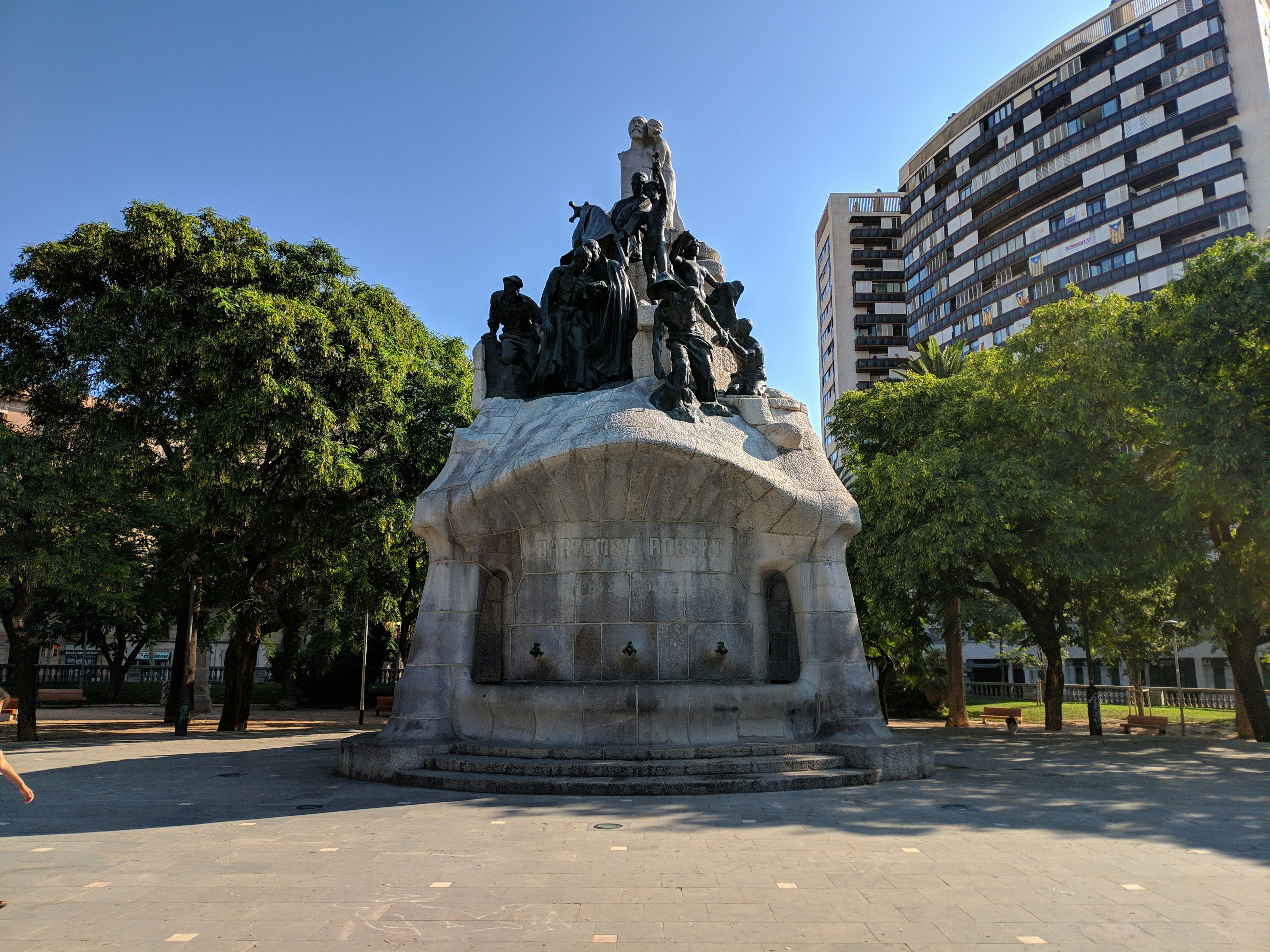 a statue of a man on a horse in a park