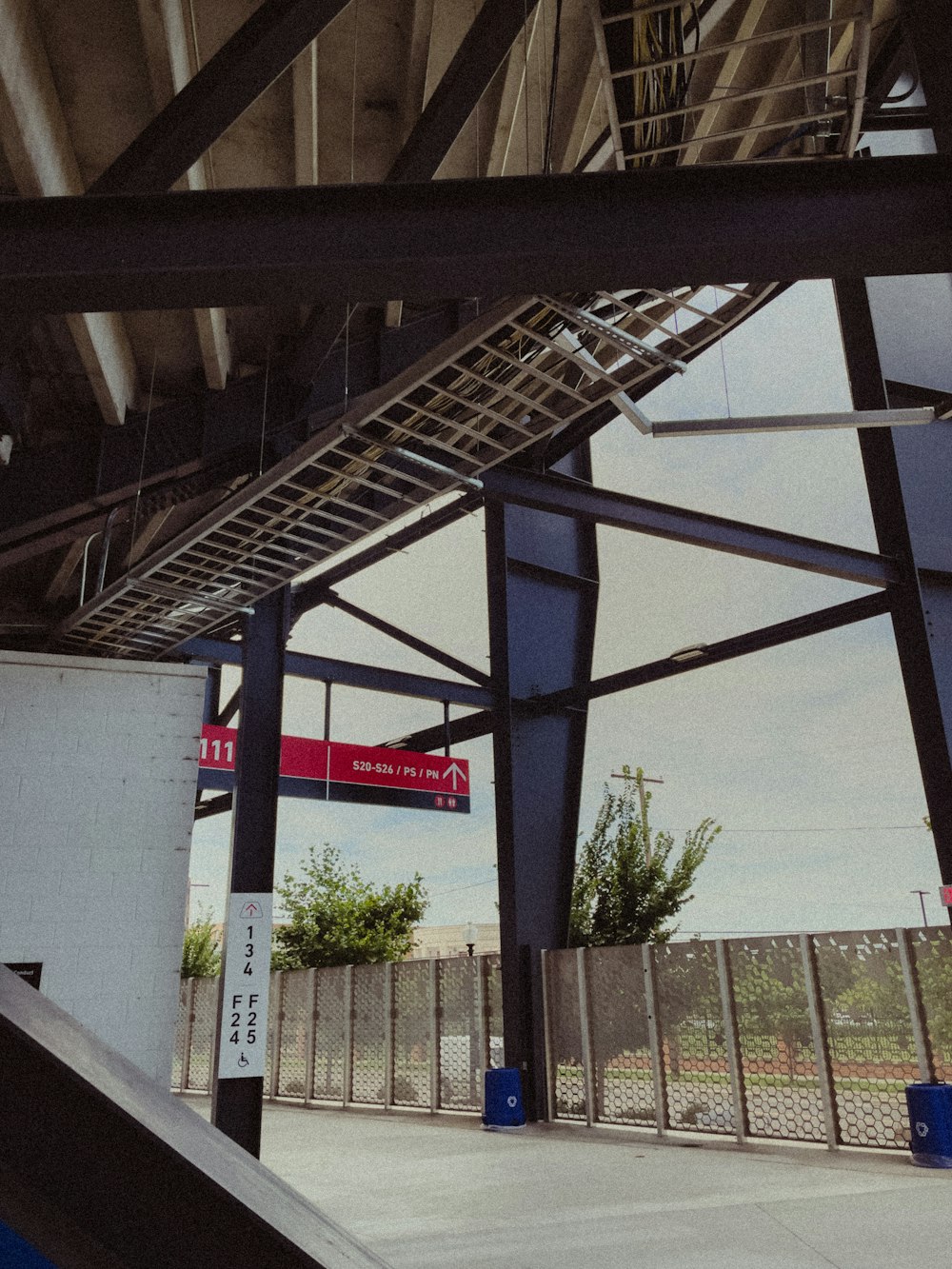 a skateboarder is going down a ramp at a skate park