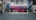 Close-up of a neixo UV printer in action, printing vibrant colors on a product surface.
