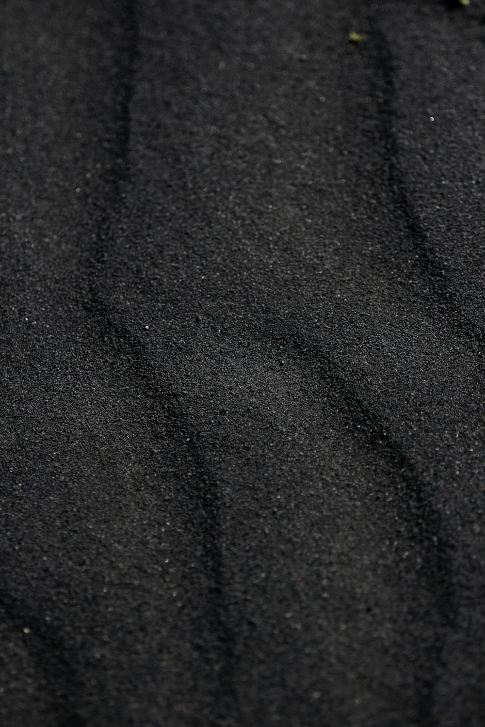 a close up of a black sand beach