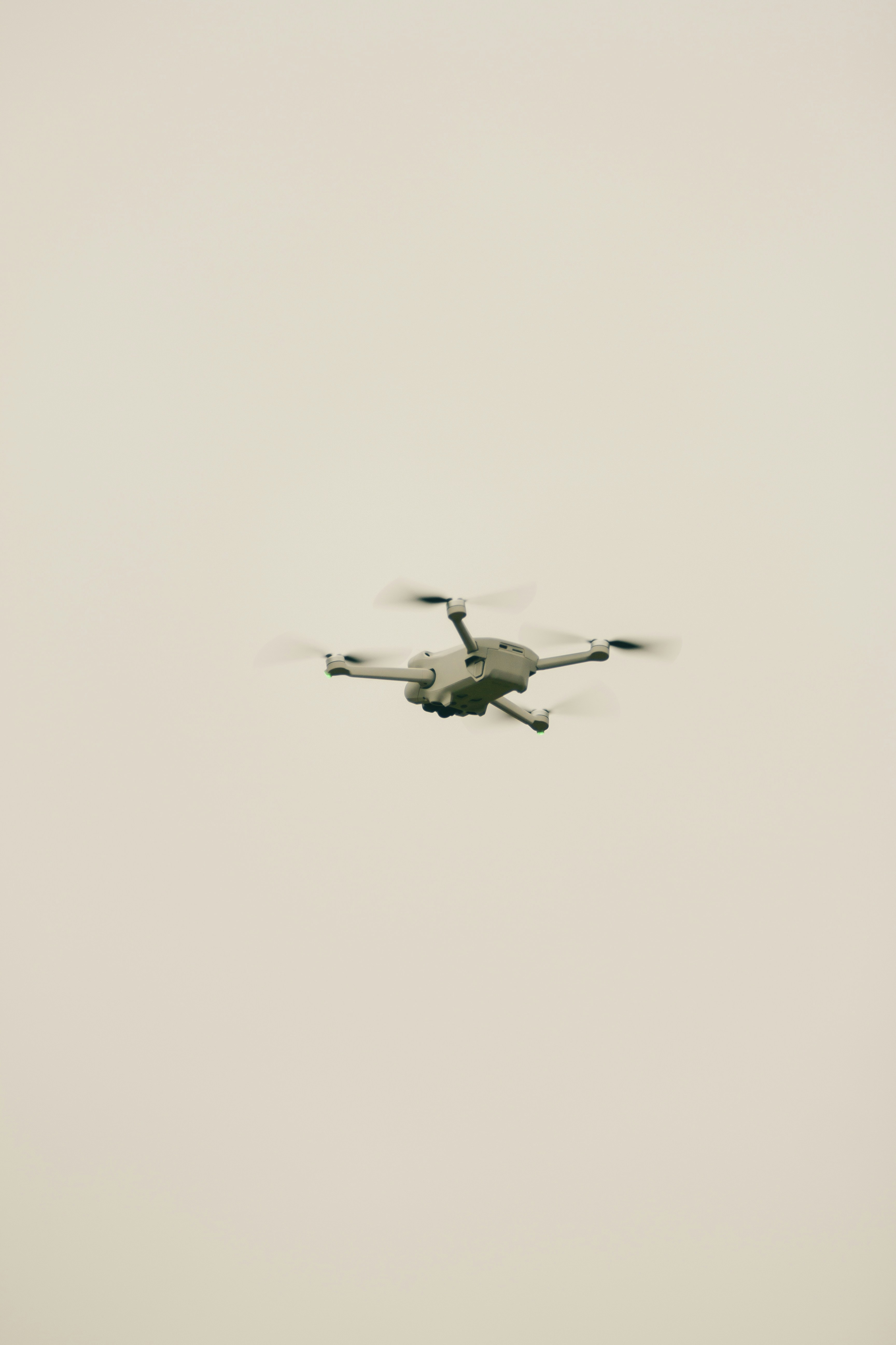 a large propeller plane flying through a foggy sky