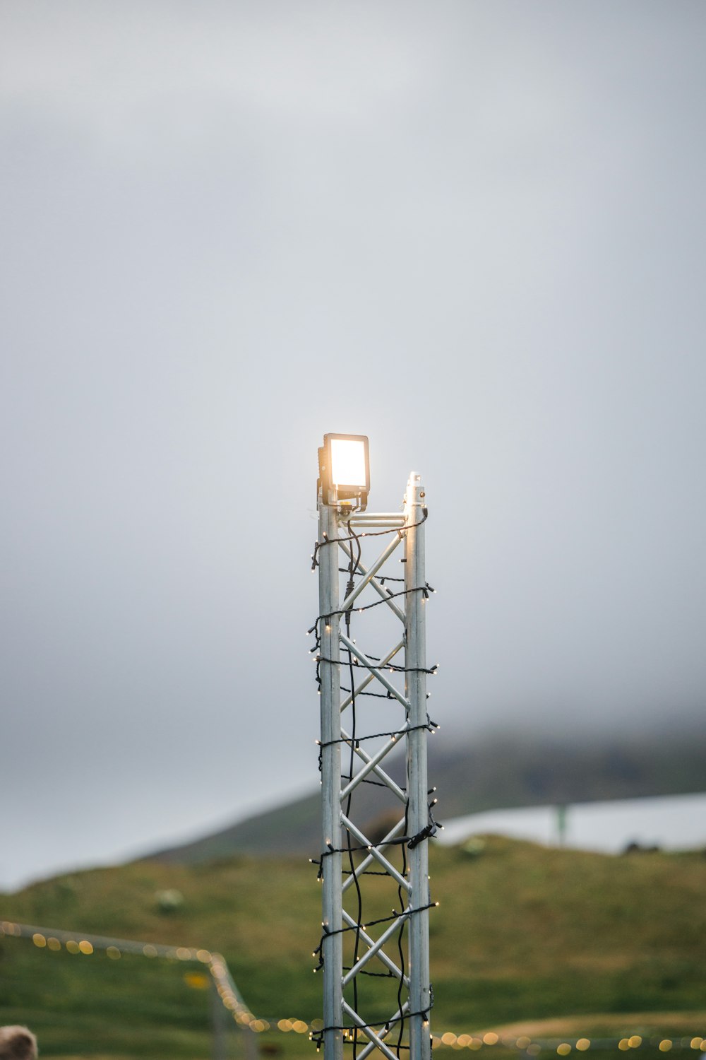 a tall metal structure with a light on top of it