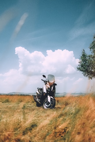 a motorcycle parked in the middle of a field