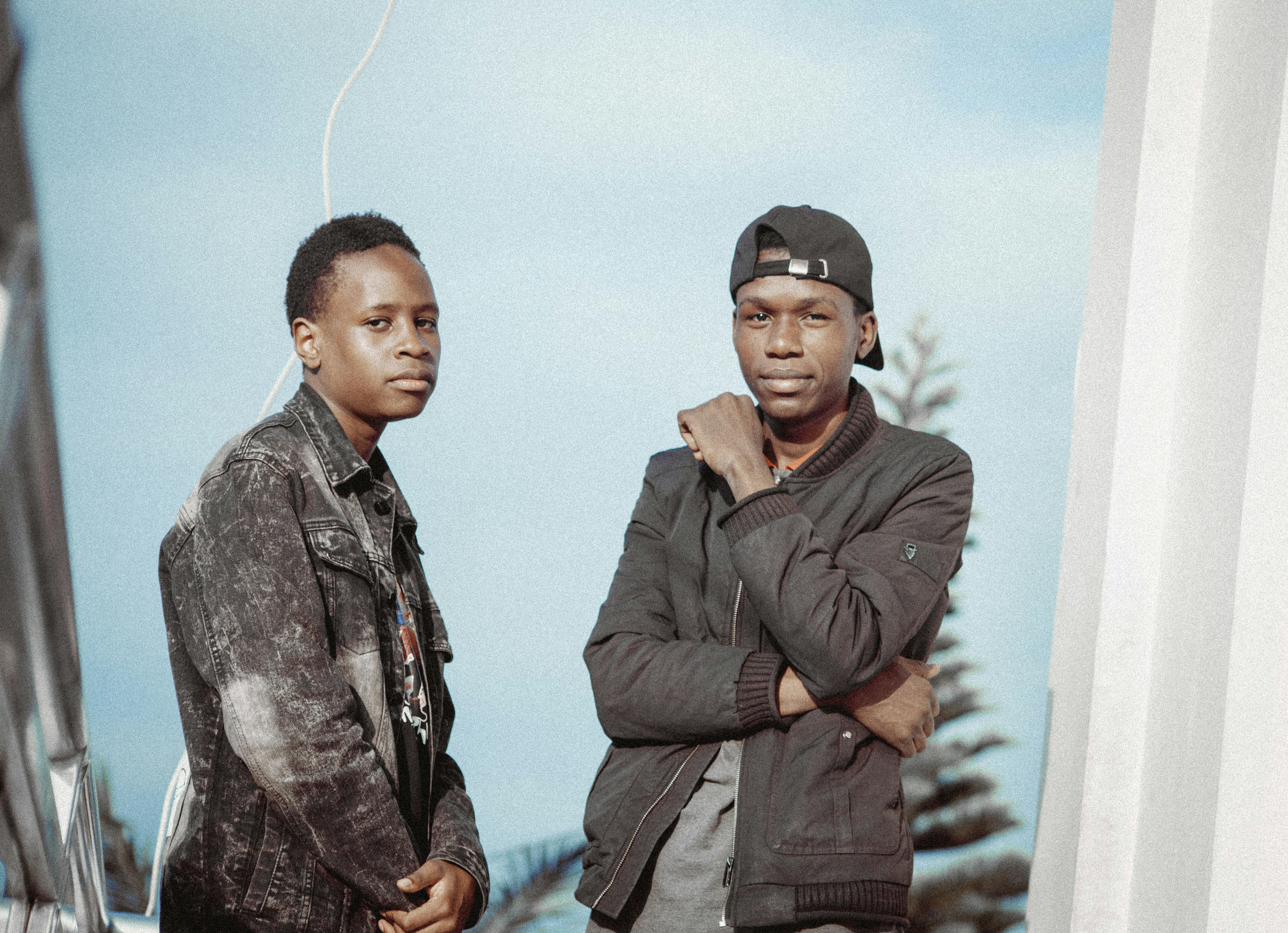 a couple of men standing next to each other